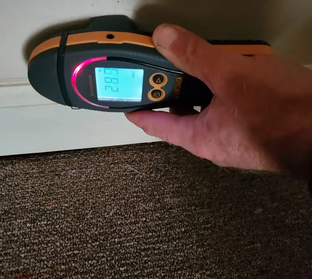 Moisture detection at baseboard during Burst Pipe Cleanup in Topeka